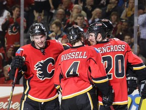 Sean Monahan of the Calgary Flames celebrates with teammates after a goal against the Arizona Coyotes at Scotiabank Saddledome in Calgary on Tuesday. The Flames won 5-2.