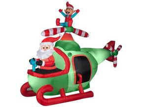 An inflatable helicopter Santa.