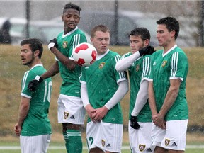 Calgary Foothills U23 team members block a shot from FC Edmonton Reserves during the first game in the history of the Foothills Soccer Association's U23 program in Calgary last April. The squad is set to join the United Soccer League's Premier Development League full time in 2015.