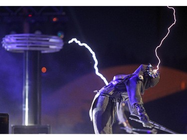 Skyfire performer Jennifer Drilling harnessed electrical bolts coming from a Tesla coil in electrifying act of the new Calgary Stampede Grandstand Show Barnburner during the annual Calgary Stampede Sneak-A-Peek on July 3, 2014. The show pays tribute to the chuckwagon legacy of High Rivers Glass family.