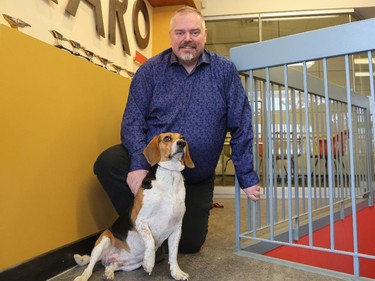 Bill Fitch and his beagle, Rerun, at Karo Group in Calgary.