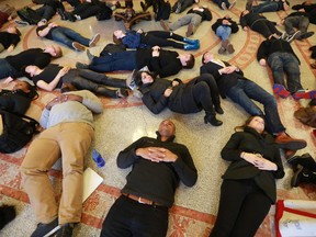 Students lie on the ground at the University of Pennsylvania on Tuesday to protest the fatal August shooting of Michael Brown by a Ferguson, Mo., police officer.