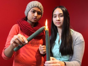 Science major Janessa Bretner, right, wasn't born when Marc Lepine gunned down 14 female students at Montreal's Ecole Polytechnique in 1989, but she is passionate about helping to mark the tragic event as one of the volunteers of this year's vigil, to be held Friday at the U of C. She was photographed with fellow volunteer Psychology major Sabrina Islam.