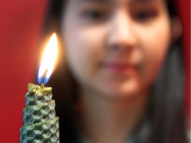 Science major Janessa Bretner wasn't born when Marc Lepine gunned down 14 female students at Montreal's Ecole Polytechnique in 1989. But she is passionate about helping to remember their deaths, as one of the volunteers of this year's vigil Friday at lunchtime at the U of C. She was photographed on December 4, 2014 in advance of the service Friday.