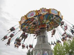 Visitors enjoy the swings on the Dream Machine at Calaway Park in Calgary on Saturday, Aug. 16, 2014.