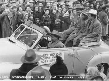 Harry Anderson, Normie Kwong and Bob Leatham ride in the parade celebrating the Calgary Stampeders' 1948 Grey Cup win.