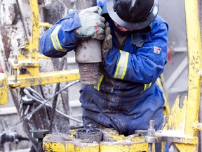 Local Input~ Blake Fairclough, an Ensign roughneck working for Nexen, positions a section of pipe to the drilling hole while tripping pipe at one of the Nexen&#180;s rigs at the Dilly Creek site north east of Fort Nelson, B.C. Canada. Nexen is currently working on two shale gas plays in the Horn River Basin &#8211; Cordova and Dilly Creek with most of the expansion focused on Dilly Creek where they have a 100 percent interest in 85,000 acres in the northeastern part of B.C., Canada. Handout/ Nexen Inc.