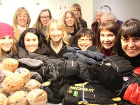 United Way staff collect gloves and muffins to hand out on Cash Corner.