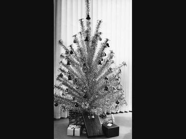 :  The silver aluminum Christmas tree was a popular home decor choice in 1963.
