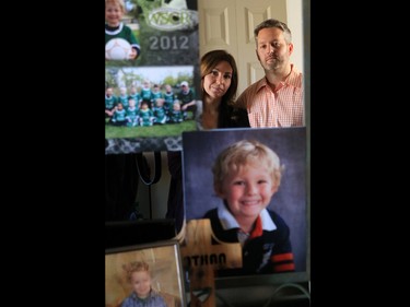 Rod and Jennifer, the parents of Nathan O'Brien, are reflected in a mirror and surrounded by photos of their son Nathan in his bedroom in their Calgary home. The O'Brien announced a foundation in Nathan's name to help benefit children on October 28. Nathan and his grandparents Alvin and Kathy were murdered under mysterious circumstances in June.