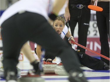 Team Europe's Anna Sloan yells for her mixed doubles partner Christoffer Svae to sweep harder during mixed doubles Continental Cup action at the Markin MacPhail Centre in Calgary, on January 10, 2015. Team Europe won this 6-5 nail-biter match.