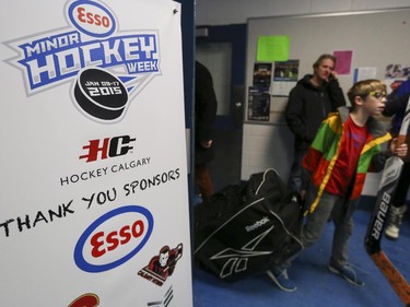 Players and parents get ready to leave the Max Bell Arena after PeeWee league hockey match on the first day of the Esso Minor Hockey Week in Calgary, on January 10, 2015. The 36th annual EMHW will be held at rinks across the city from January 10 to 18, 2014.