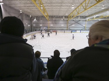 Spectators fill the stands at the Max Bell Centre  on the first day of the Esso Minor Hockey Week in Calgary, on January 10, 2015. Hockey Calgary is asking coaches and players to avoid shaking hands with referees at the end of games, hoping to prevent post-game altercations, suspensions and verbal abuse.