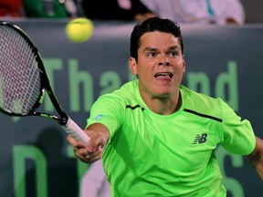 Milos Raonic of Canada returns a shot to Tomas Berdych of Czech Republic during the final round of The World Tennis Thailand Championship in Hua Hin on January 2, 2015. Berdych defeated Raonic 7-6(4), 6-3. AFP PHOTO / STRSTR/AFP/Getty Images