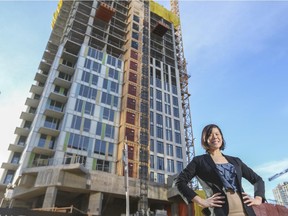 Felicia Mutheardy, senior market analyst for Canada Mortgage and Housing Corp., near residential condo construction in downtown Calgary, on December 17, 2014.
