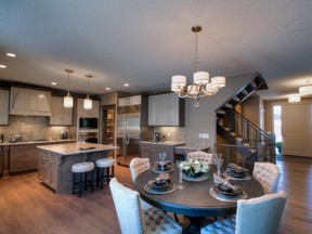 Dining area and kitchen in STARS Lottery 2015 home by Augusta Fine Homes in Crestmont.
