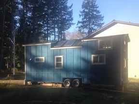 Kirsten Shaw and Michael Hunt built a tiny home, pictured, in their Calgary backyard before towing the abode to Vancouver Island.