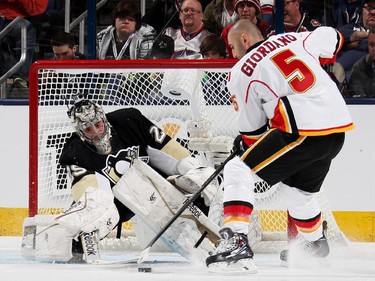 Mark Giordano #5 of the Calgary Flames and Team Toews competes against Marc Andre-Fleury #29 of the Pittsburgh Penguins and Team Foligno during the Discover NHL Shootout event of the 2015 Honda NHL All-Star Skills Competition at Nationwide Arena on January 24, 2015 in Columbus, Ohio.