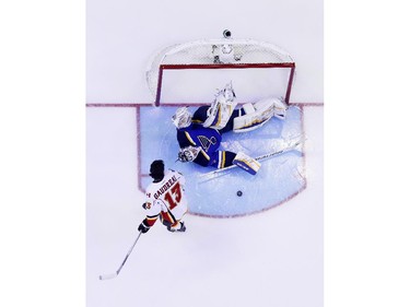 Johnny Gaudreau #13 of the Calgary Flames and Team Toews shoots against Brian Elliott #1 of the St. Louis Blues and Team Foligno during the 2015 Honda NHL All-Star Skills Competition at Nationwide Arena on January 24, 2015 in Columbus, Ohio.