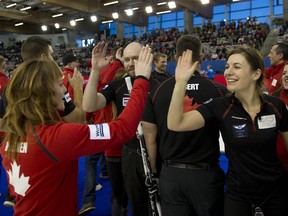 Team Canada had plenty to celebrate about during the 2015 World Financial Group Continental Cup in Calgary. Team Canada members Dawn McEwen (L) and Rachelle Brown (R) give a high five after guiding Team Canada to victory over Team Europe 301/2 to 91/2 to clinch the cup.