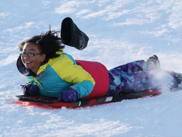 Sledders enjoy near perfect conditions in the fresh snow on the hill in St. Andrews Heights on Sunday January 11, 2015.