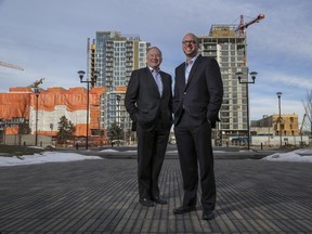 Michael Brown, right, president and CEO Calgary Municipal Land Corporation, with Lyle Edwards, chairman, in front of some East Village construction in Calgary, on January 27, 2015.