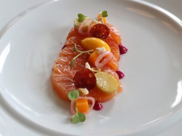 A plate of Maple Cured Artic Char with pickled squash, beetroot and hazelnuts in the old National building.