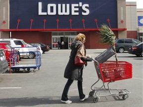 A customer shops at Lowe's in New York. The company is hiring people for its Canadian operations.