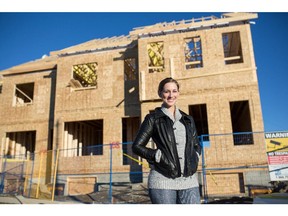 Ali Shaffer outside the her new home, under construction, at Juno in Currie Barracks.