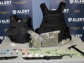 ALERT searched a home in the 700 block of 13th Street South on Friday, January 23, 2015, and seized drugs with an estimated street value of $15,000, drug paraphernalia, cash, body armour, a 12-gauge shotgun, and a semi-automatic Ruger .22 calibre rifle with a silencer and stock modifications allowing for a higher capacity magazine. Courtesy ALERT.