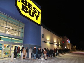 About 250 shoppers wait outside the Sunridge Best Buy just before the 6 a.m. opening for Boxing Day.
