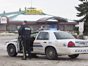 Police contain the scene where two RCMP officers were shot in St. Albert, on Saturday, January 17, 2015.