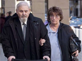 Aubrey Levin, left, convicted of sexually assaulting three of his  patients, leaves court in Calgary, Monday, Oct. 15, 2012 with his wife Erica.