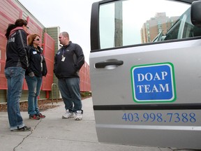 Alpha House outreach co-ordinator Adam Melnyk, right, talks with fellow outreach workers Jody Avely, left, and Jill Kirk before heading out on the streets in 2012.