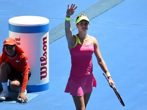 Canada's Eugenie Bouchard (R) celebrates her victory over France's Caroline Garcia in their women's singles match on day five of the 2015 Australian Open tennis tournament in Melbourne on January 23, 2015.