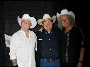 Brian May, right, shown wearing the Smithbilt white hat he was gifted with during a visit last year to Calgary.