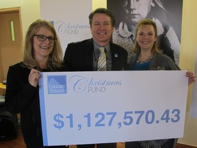 Pictured, from left, at the Calgary Herald Christmas Fund presentation held Jan 28, 2015 are the Herald's executive producer Monica Zurowski, Lorne Motley, Calgary Herald editor and Laura Linnell, Herald Christmas Fund volunteer committee chair. This past year was the 24th year since the inception of the fund which has raised a staggering $22.9 million for myriad charities.