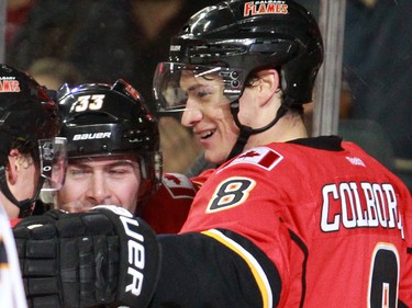 The Calgary Flames' Joe Colborne celebrates with teammates after scoring against the Buffalo Sabres in NHL action at the Scotiabank Saddledome on Tuesday Jan. 27, 2015.