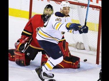 Gavin Young, Calgary Herald
CALGARY, AB: JANUARY 27, 2015 - Buffalo Sabres right winger Chris Stewart celebrates scoring on Calgary Flames goaltender Jonas Hiller during the first period of NHL action at the Scotiabank Saddledome on Tuesday Jan. 27, 2015.
(Gavin Young/Calgary Herald)
(For Sports section story by Scott Cruikshank) Trax# 00057775A