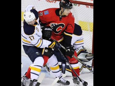 Gavin Young, Calgary Herald
CALGARY, AB: JANUARY 27, 2015 - The Calgary Flames' Joe Colbourne and Buffalo Sabres' Torrey Mitchell battle for position in front of the net during the second period of NHL action at the Scotiabank Saddledome on Tuesday Jan. 27, 2015.
(Gavin Young/Calgary Herald)
(For Sports section story by Scott Cruikshank) Trax# 00057775A