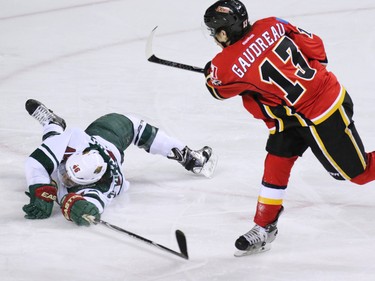 Gavin Young, Calgary Herald
CALGARY, AB: JANUARY 29, 2015 - Calgary Flames forward Johnny Gaudreau just missed on this break-away in front of a stretching Minnesota Wild Jared Spurgeon during the third period of NHL action at the Scotiabank Saddledome on Thursday Jan. 29, 2015. The Wild won the game 1-0.
(Gavin Young/Calgary Herald)
(For City section story by Scott Cruikshank) Trax# 00057776A