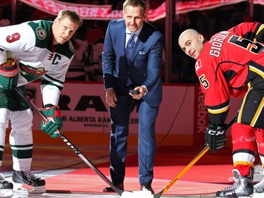 Calgary Flame alumni Gary Roberts was honoured on alumni night before the Calgary Flames Minnesota Wild game at the Scotiabank Saddledome on Thursday Jan. 29, 2015. Roberts dropped the puck with captains Mikko Koivu and Mark Giordano.