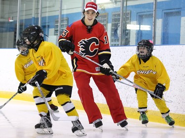 Calgary Flames star rookie Johnny Gaudreau skates with the Blackfoot Chiefs Atom 5 team after surprising them in their dressing room at the Acadia Recreation Centre Friday night. The event sponsored by Bauer also included all the team receiving Bauer hockey sticks.