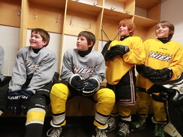 Members of the Blackfoot Chiefs Atom 5 team listen to Calgary Flames star Johnny Gaudreau after he surprised the Blackfoot Chiefs Atom 5 team in their dressing room at the Acadia Recreation Centre before their practise Friday night. The event sponsored by Bauer also included all the team receiving Bauer hockey sticks and Gaudreau skated with the team during their practise.