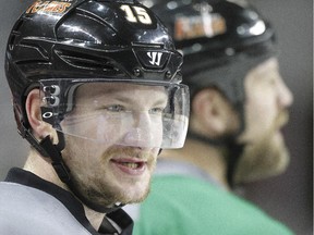 Calgary Flames defender Ladislav Smid watches teammates during practice on Monday. Smid's wife gave birth to twins on Christmas Eve, six weeks before her due date.