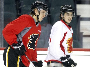 Calgary Flames forward Markus Granlund, left, skates alongside fellow rookie Johnny Gaudreau during practice Thursday after being sent to the minors then recalled the next day to fill in for the injured Josh Jooris.
