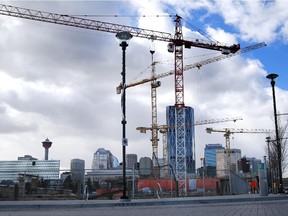 Cranes dot the city skyline as Calgary's East Village begins its transformation.