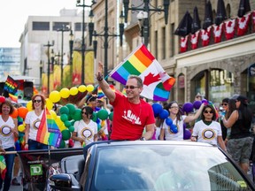 Grand Marshal Del Shores starts off the 24th Annual Pride Parade on 8th Avenue in downtown Calgary on August 31, 2014.