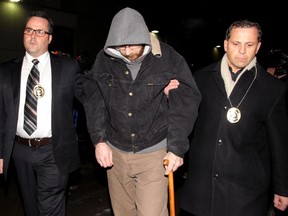 Will Rempel, a suspect in the Ryan Lane murder is taken into the Court Services building in Calgary, Alberta on November 29, 2012.