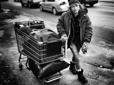 Barbie Harris, 50, has been homeless on and off throughout her life. Here she walks the streets in Calgary.